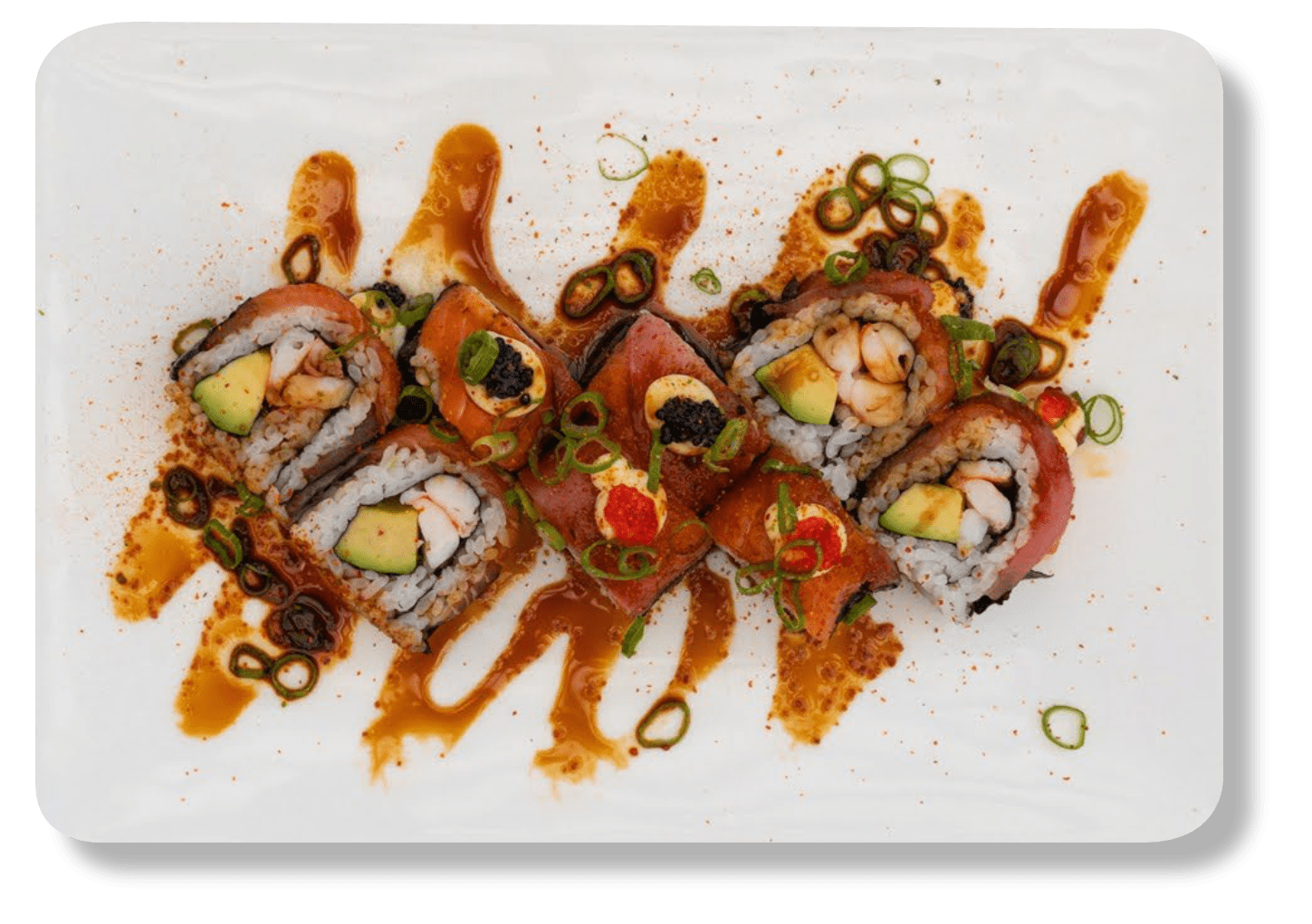 Rainbow Reloaded sushi pieces with garnish and sauce on a plate.